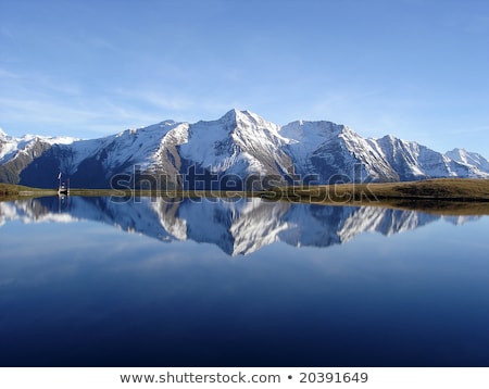 Stockfoto: Symmetry Reflection On The Lake