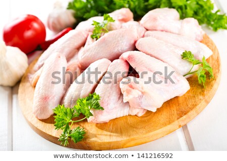 Stock photo: Raw Chicken Wings With Chopped Parsley