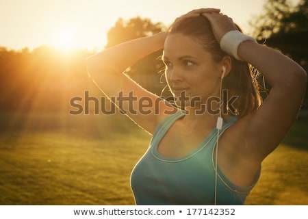 Foto d'archivio: Happy Woman With Earphones Running