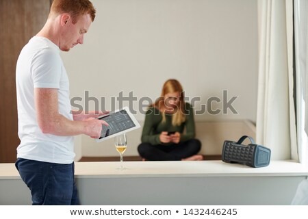 Stock foto: A Couple Listen To A Speaker