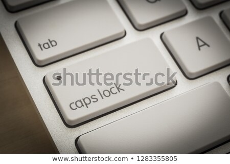 Stock fotó: Caps Lock Button On White Keyboard Dark Filter