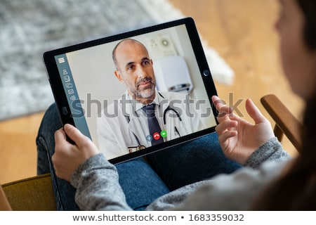 [[stock_photo]]: Online Consultation At Doctor Consulting Patients