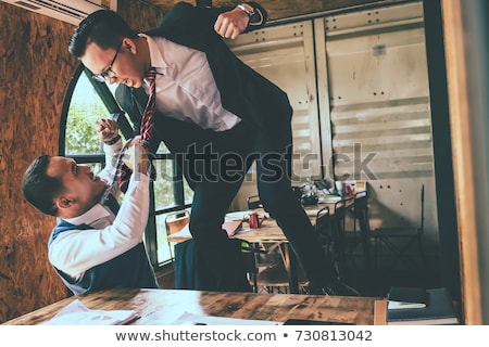 Stockfoto: Businessman Fighting With His Colleague In Office