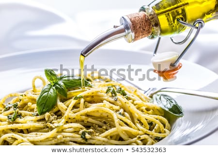 Foto d'archivio: Bottle Of Olive Oil And Spaghetti