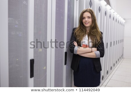 Foto stock: Girl With Arms Crossed Working At Data Storage Facility