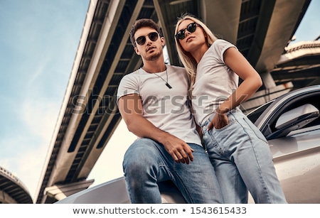 Stock photo: Beautiful Blond Young Woman Near A Sports Car