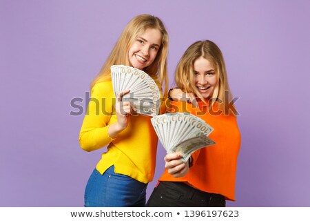 Сток-фото: евочки-близнецы · с · долларами · 2