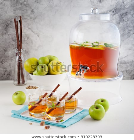 Foto d'archivio: Apple White Wine Punch Tea Mulled Cider With Spices In A Beverage Dispenser With Fresh Apples And