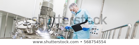 Stockfoto: Scientist In Checking The Readings