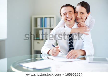 Businessman And Businesswoman Embracing Stockfoto © Pressmaster