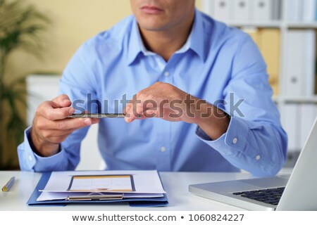 Stock foto: Businessman Taking Photograph In Office