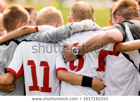 Happy Sporty Kids In A Team Players In A Team Huddling With Coach Before The Tournament Final Match Stockfoto © matimix