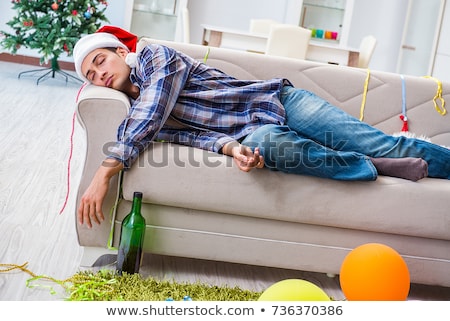Stock fotó: Man Having Hangover After Christmas Party