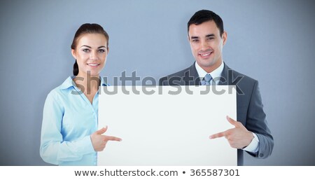 Stok fotoğraf: Woman Holding Blank Advertising Panel In Front Of Man