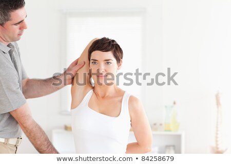 Stock foto: Charming Patient Doing Some Exercises Under Supervision In A Room