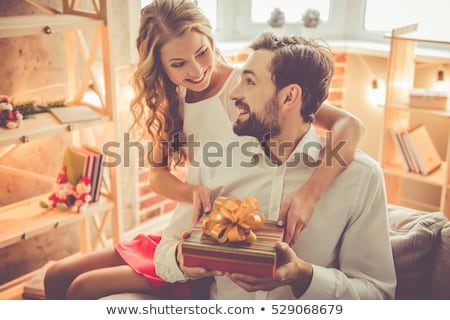 ストックフォト: Young Woman Giving Present To Her Boyfriend