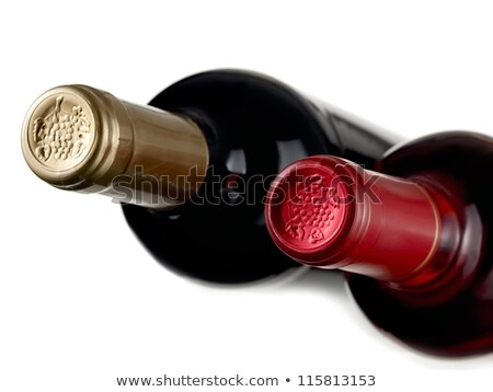 Foto d'archivio: Wine Glass Full With Grapes And Two Wine Bottles