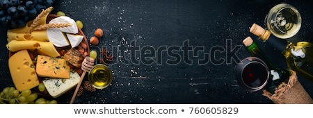 Stockfoto: White Wine In Glass With Cheese Honey Nuts And Grape