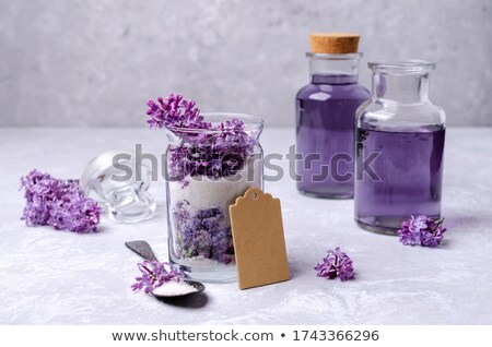 Сток-фото: Lilac Flowers Sugar With Flower Blossoms In Glass Jar Grey Stone Background