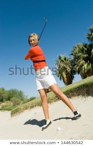 Stok fotoğraf: Low Angle View Of Woman Standing On Sand Against Clear Sky