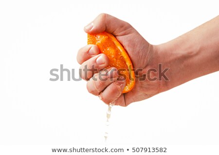 Stockfoto: Hand Squeezing Orange Juice