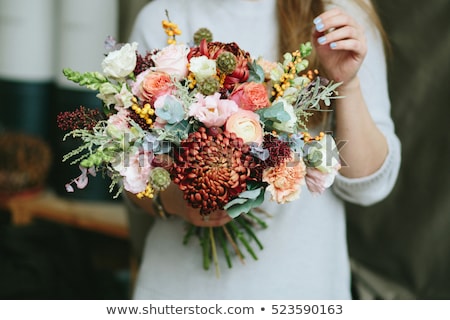 Foto d'archivio: Tender Woman With Bouquet Of Flowers