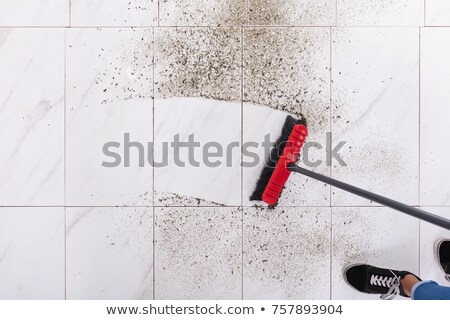 Foto stock: Broom Cleaning Dirt On Tiled Floor