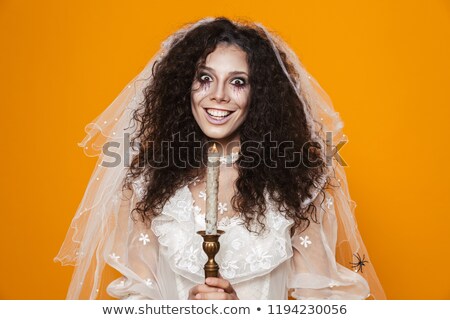 Foto d'archivio: Cheerul Beautiful Dead Bride Holding Candle Isolated