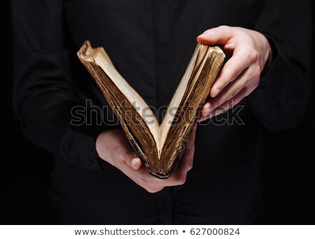 Stockfoto: Hands Holding Old Bible