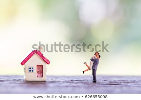 Stok fotoğraf: Couple With Miniature House