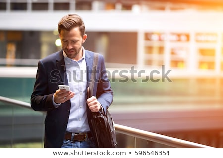 Foto stock: Business Man Walk With Phone