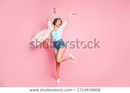 Stock fotó: Girl Dancing With Disco Background