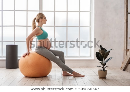 ストックフォト: Pregnant Woman Doing Stretching Exercise