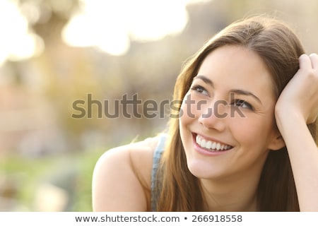 Stockfoto: Close Up Portrait Of A Pretty Young Woman Looking Away