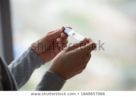 Foto stock: A Mother Changing A Baby In A Meeting