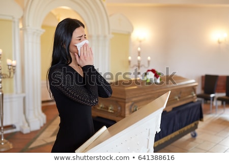 Stok fotoğraf: Close Up Of Woman With Wipe At Funeral In Church