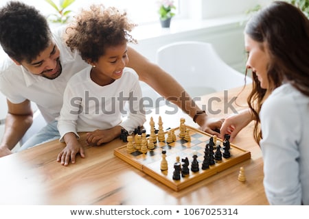 [[stock_photo]]: Family Playing Chess