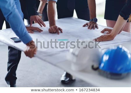 Construction Team Looking At Plans [[stock_photo]] © dotshock