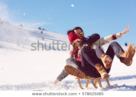 Stock photo: Young Couple Sledding