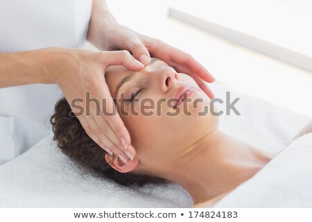 Foto d'archivio: Attractive Young Woman Receiving Forehead Massage