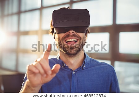 Foto stock: Happy Man In Virtual Reality Headset Or 3d Glasses