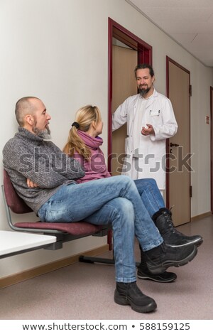 Stok fotoğraf: Male Doctor Opening Door In A Lobby