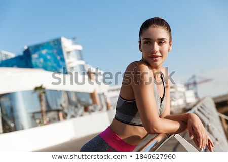 Stok fotoğraf: Close Up Happy Young Sportswoman At The Seaside