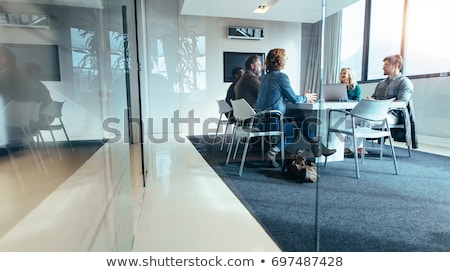 Foto stock: Businessman Talking To Colleagues And Clients In Office Meeting Room