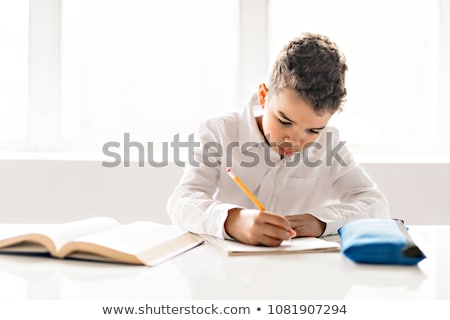 Zdjęcia stock: A Cute Black Boy Doing Homework At Home