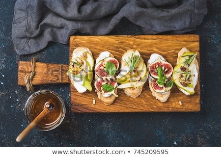 Stok fotoğraf: Bruschetta And Crostini With Pear Ricotta Cheese Honey Figs