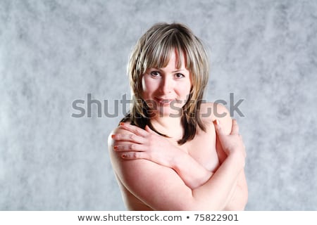 Foto stock: Topless Woman In Jeans Covering Her Breasts