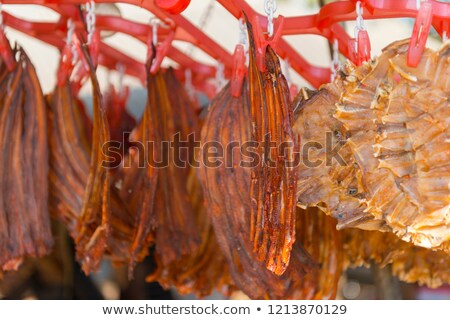 Foto d'archivio: Dried Fish For Sale Hanging At Asian Food Market