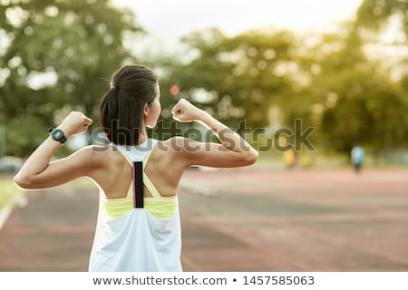 Foto d'archivio: Sporty Woman Showing Her Biceps