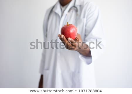 Stock fotó: Doctor Holding Red Apple On White Close Up